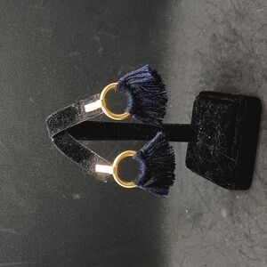 Gold tone metal navy blue ruffle pierced earrings